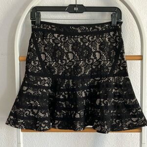 Parker black lace mini skirt w beige underlay size 6